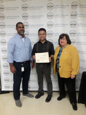 male grad student with two  staff members at larkin university